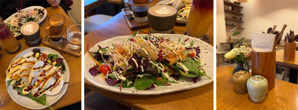 Bao-Brötchen mit Rinderschinken, Sauerteigbrot mit Avocadocreme, Blattsalaten, Lachs und Ei und frische Blumen auf dem Tisch