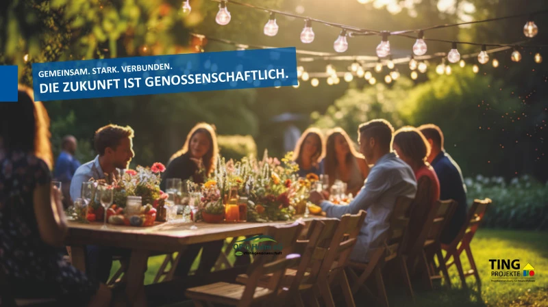 Ein mit Blumen gedeckter langer Tisch an dem viele unterschiedliche Personen sitzen und sich unterhalten.