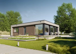 Modernes Fertighaus umgeben von grünem Rasen