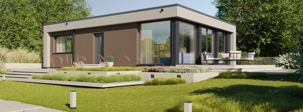 Modernes Fertighaus umgeben von grünem Rasen