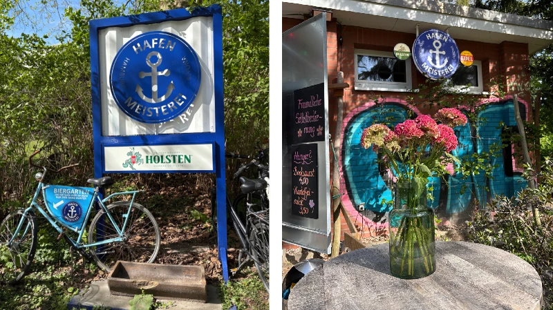 Eingangsschild der Hafenmeisterei mit Fahrrad und Blumenstrauß